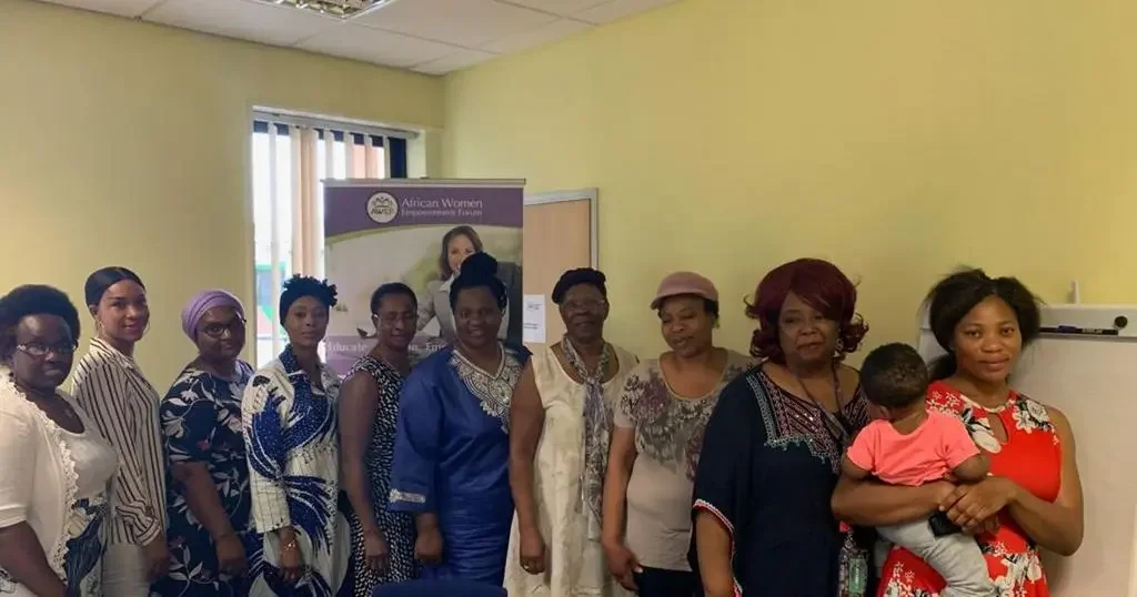Faith Gakanje-Ajala with women at an African Women’s Empowerment Forum gathering.